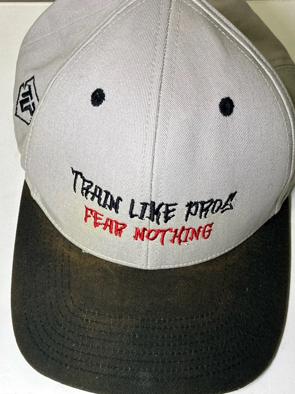 Two-Tone Black and‎ Cream Baseball Cap with Embroidered Slogan